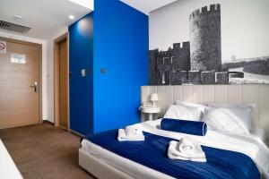 Voodi või voodid majutusasutuse Hotel Passport toas