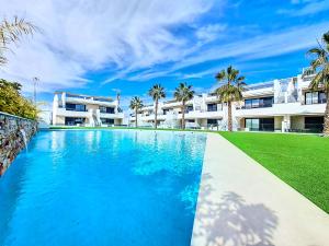 an image of a swimming pool in front of a building at La Llana Beach MDC - 5610 in Mar de Cristal