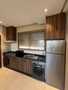 Η κουζίνα ή μικρή κουζίνα στο Appartement golfe prestigia marrakech