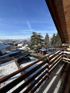 a view from the balcony of a house with a fence at Vikendica Rakovica in Rakovica
