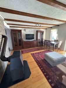 a large living room with a couch and a table at Vikendica Rakovica in Rakovica