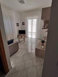 a living room with a couch and a table at Il Geco in Vezzano Ligure