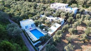 an aerial view of a house with a swimming pool at Eman Villas in Ulcinj
