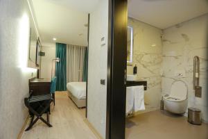 Postel nebo postele na pokoji v ubytování Milord Hotel