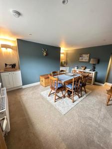 a dining room with a table and chairs at Prior House Farm in Berwick-Upon-Tweed