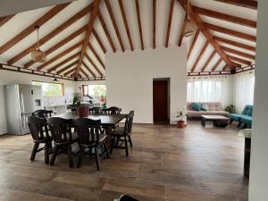 a dining room with a table and chairs in a room at Casa Silvestre in Villa de Leyva +49 photos