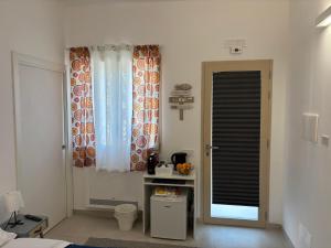 a room with a bed and a window and a door at Villa Isma Superior Rooms in Realmonte +52 photos