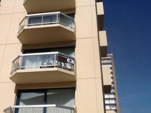 a building with a balcony on the side of it at Morgenzon Apartment in Nieuwpoort