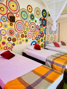 Postel nebo postele na pokoji v ubytování Aira Bay Resort Arugambay