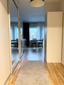 a living room with a table and a dining room at BRAND NEW & Nice Apartment Gothenburg in Gothenburg