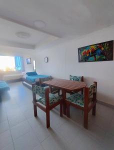 a living room with a table and chairs and a couch at Cartagena in Cartagena de Indias