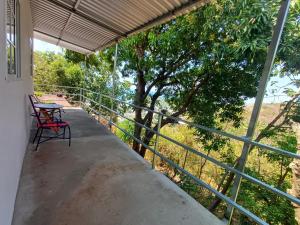 a balcony of a house with a table and chairs at Punta Roca View 2 in La Libertad +5 photos