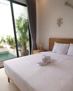 Ένα ή περισσότερα κρεβάτια σε δωμάτιο στο Bikini Top Villa Umalas