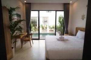 Ένα ή περισσότερα κρεβάτια σε δωμάτιο στο Bikini Top Villa Umalas +56 φωτογραφίες