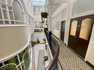 an empty hallway of a building with a balcony at Lennon Place in Liverpool
