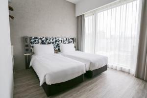 Ein Bett oder Betten in einem Zimmer der Unterkunft Page148, Page Hotels