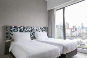 Ein Bett oder Betten in einem Zimmer der Unterkunft Page148, Page Hotels