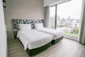 Ein Bett oder Betten in einem Zimmer der Unterkunft Page148, Page Hotels
