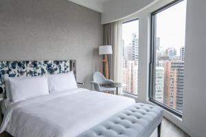 Ein Bett oder Betten in einem Zimmer der Unterkunft Page148, Page Hotels