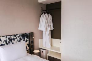 Ein Bett oder Betten in einem Zimmer der Unterkunft Page148, Page Hotels