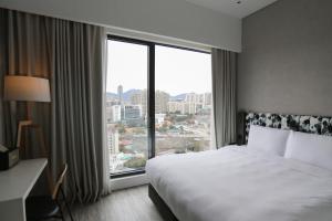 Ein Bett oder Betten in einem Zimmer der Unterkunft Page148, Page Hotels