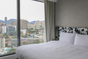 Ein Bett oder Betten in einem Zimmer der Unterkunft Page148, Page Hotels