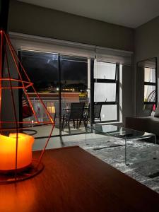 a living room with a glass table and a couch at WeThusi-CBD in Mbabane +23 photos
