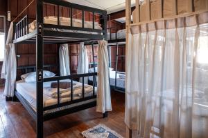 Ein Bett oder Betten in einem Zimmer der Unterkunft Moon Garden Hostel