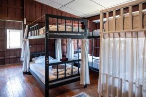 Ein Bett oder Betten in einem Zimmer der Unterkunft Moon Garden Hostel