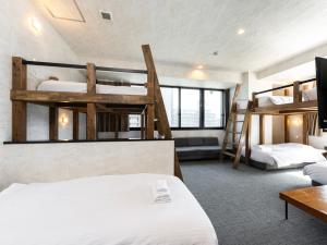 Ένα ή περισσότερα κρεβάτια σε δωμάτιο στο WELLSTAY Namba