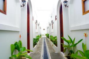 an aisle in a building with plants at M Bali 2 in Ngaglik