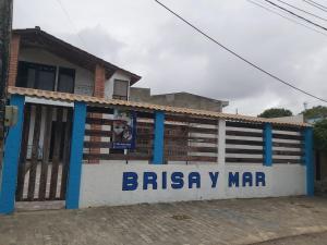 a building with a sign that reads biryani mar at Hostal Brisa y Mar in Arboletes