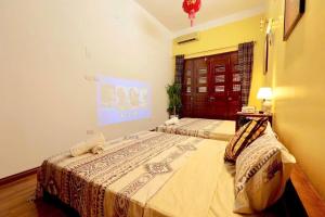 a bedroom with two beds in a room at Charm Home 2 in Hanoi