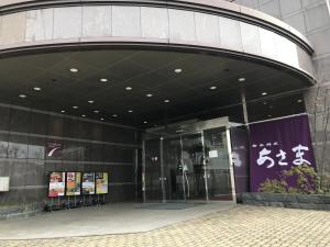 an entrance to a building with a revolving door at Chisun Grand Nagano in Nagano