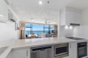 an open kitchen with a view of the ocean at Breathtaking Ocean View 2 BDR Apartment by the Beach in Gold Coast