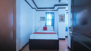Voodi või voodid majutusasutuse RedDoorz at Minas Place 1 Tacloban toas