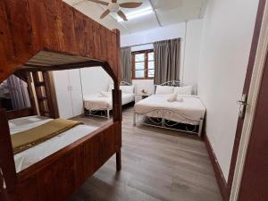 Postel nebo postele na pokoji v ubytování Mountain View Guesthouse Cameron Highlands