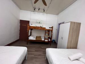 Postel nebo postele na pokoji v ubytování Mountain View Guesthouse Cameron Highlands