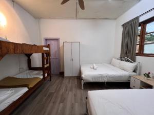 Postel nebo postele na pokoji v ubytování Mountain View Guesthouse Cameron Highlands