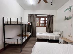 Postel nebo postele na pokoji v ubytování Mountain View Guesthouse Cameron Highlands