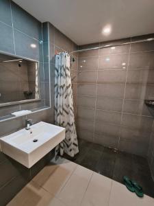a bathroom with a sink and a shower at Grand Horizon Imperium Residence Kuantan Studio City view in Kuantan