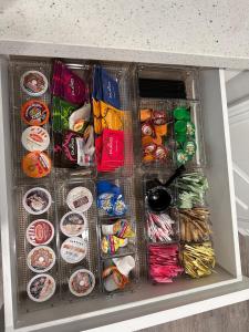 a drawer in a cabinet filled with lots of food at Doho-Enterprise Villa in Weslaco