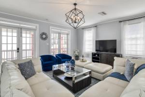 a living room with a white couch and a tv at 20 Hypolita Street in St. Augustine +33 photos