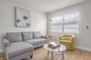 a living room with a couch and a chair at 1053 Apollo Beach Blvd Unit 2 in Apollo Beach +13 photos
