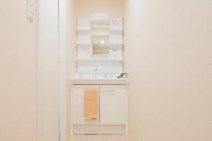 Koupelna v ubytování Sakura Villa Kotoni フルリフォーム ファミリーオススメ マーケット近く + 24 fotografií