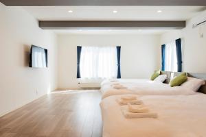 Postel nebo postele na pokoji v ubytování Sakura Villa Kotoni フルリフォーム ファミリーオススメ マーケット近く