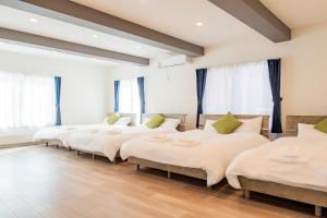 Postel nebo postele na pokoji v ubytování Sakura Villa Kotoni フルリフォーム ファミリーオススメ マーケット近く