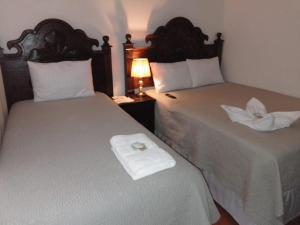 Katil atau katil-katil dalam bilik di Hotel Xakal +3 gambar