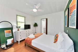 a bedroom with a large bed and a mirror at Lake Hickory Trio 2BR Green Unit in Hickory