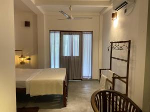 Postel nebo postele na pokoji v ubytování I Surf Weligama